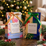 Les deux coffrets de Noël La Canopée 2026, Trio apaisant à la rose et Duo pro-âge, devant un sapin illuminé