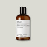 Flacon ambré du Shampoing hydratant à l'Acide Hyaluronique bio Evolve Beauty, 250 ml, sur fond vert sauge