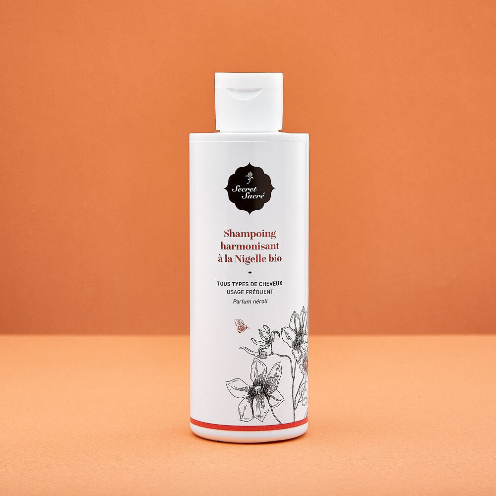 packaging sur fond orange shampoing nigelle secret sacre